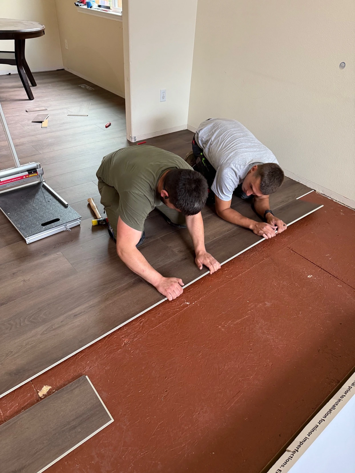Kitchen renovation progress with tools and new cabinetry installed