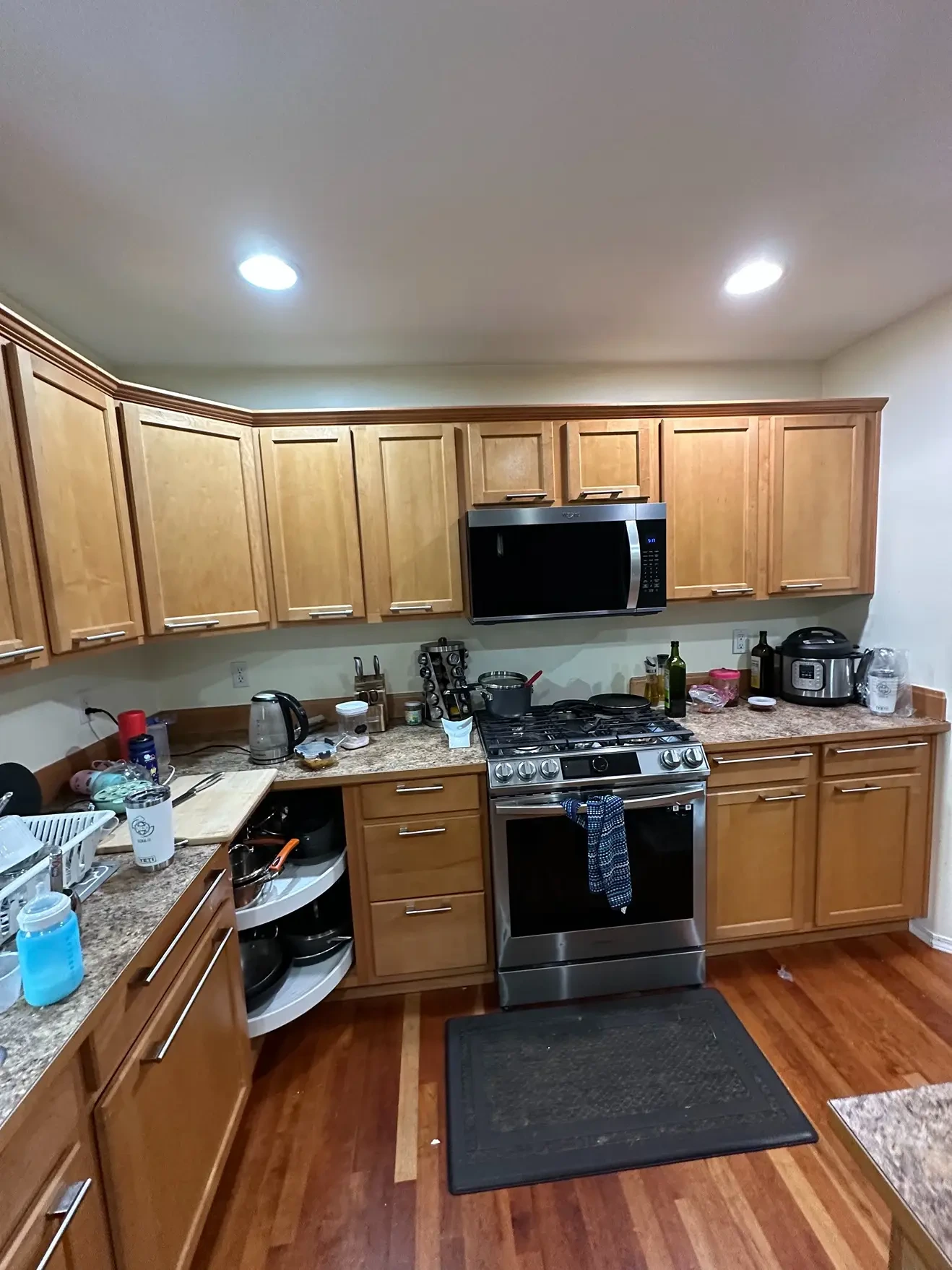 Dated kitchen with closed layout and worn cabinetry