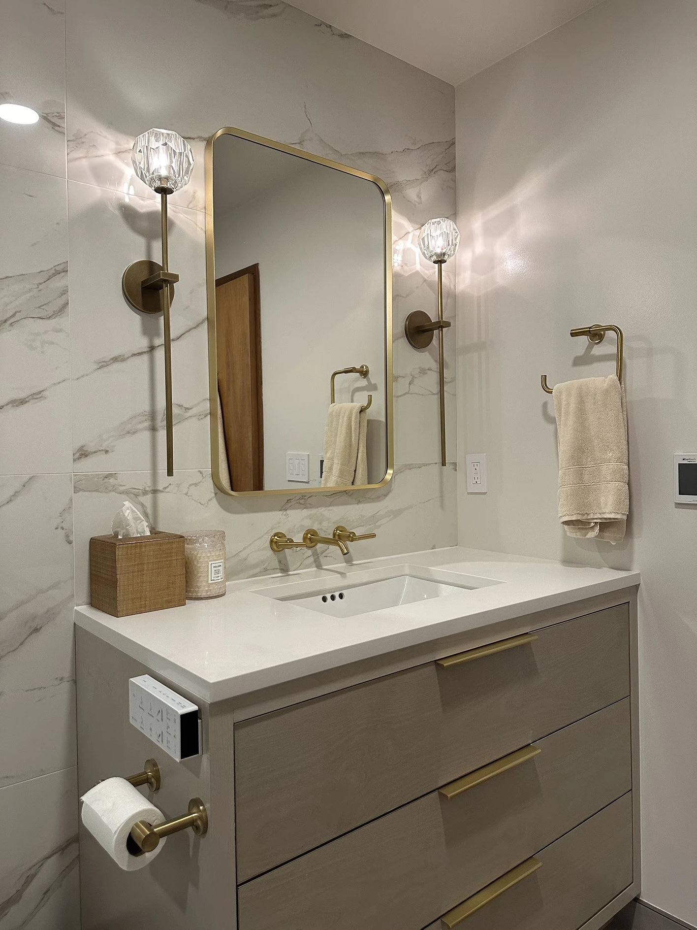 Bright renovated bathroom with walk-in shower and vanity