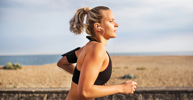 A women wearing active wear running.