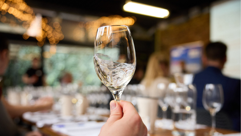 Swilring white wine in the glass