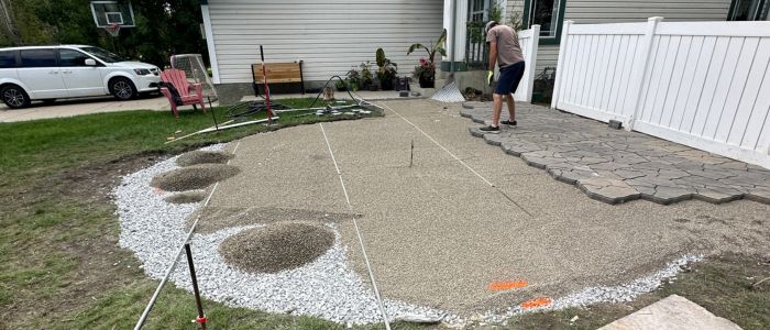 Paving stone patio installation Calgary base prep hardscaping first