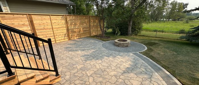 Custom fire pit install Calgary outdoor living space paving stones