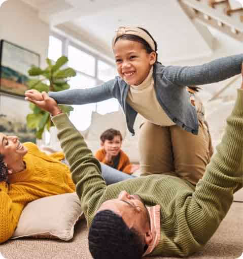 A man and a woman playing on the floor.