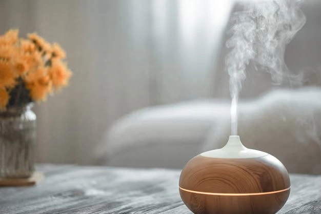 Wood-grain humidifier diffusing mist in living room.