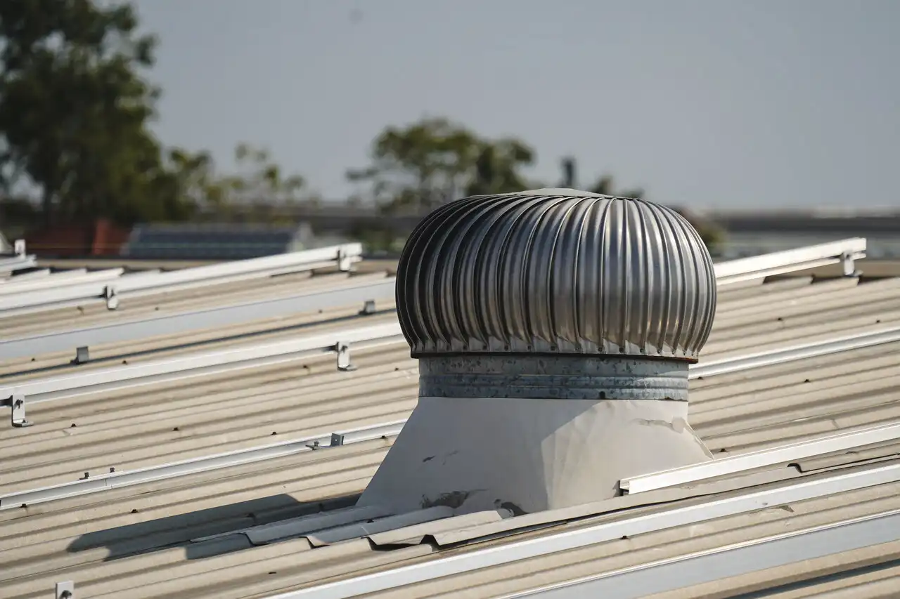 Industrial roof turbine ventilator on metal roof.