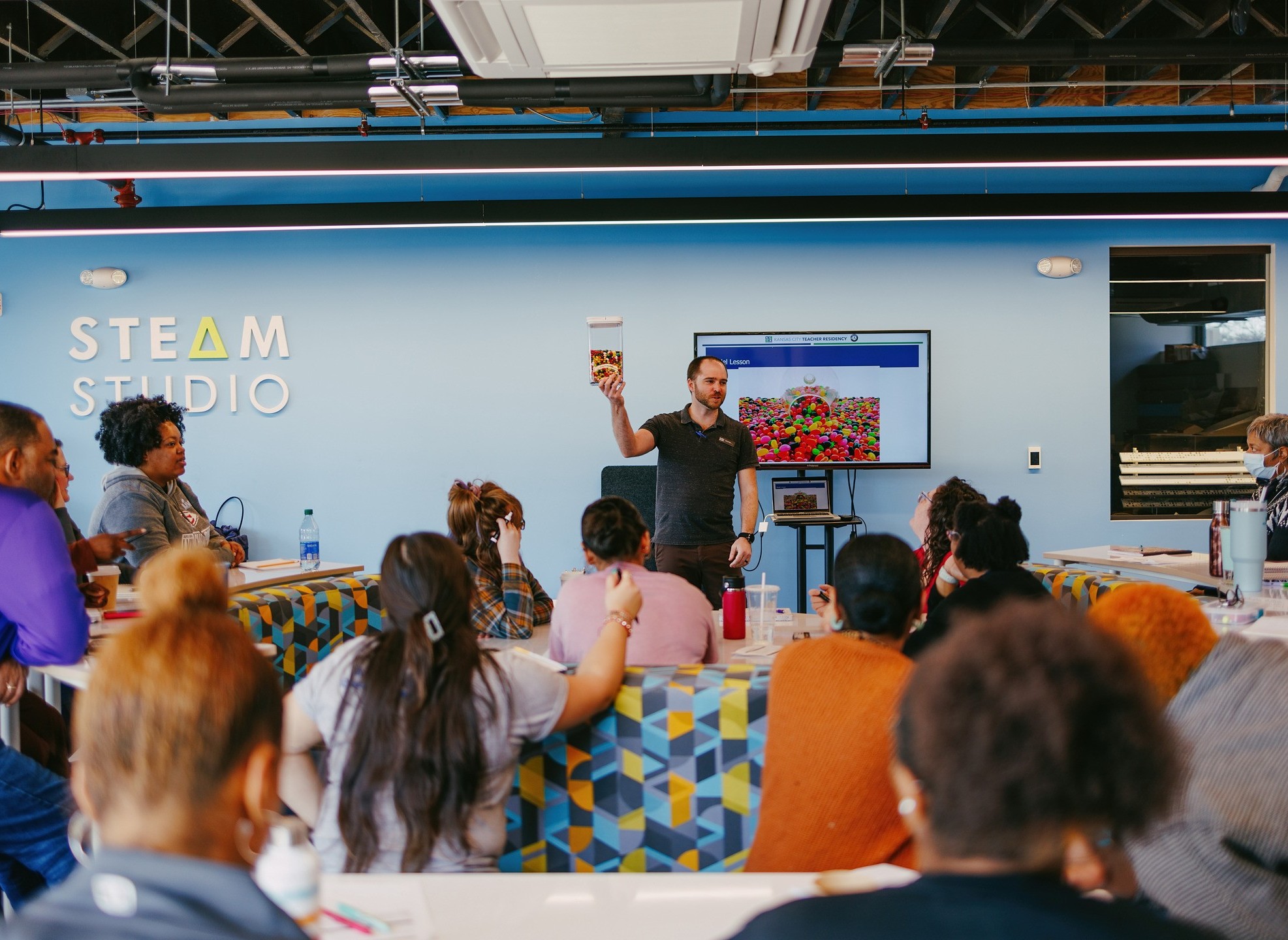 A group listening to a speaker. 