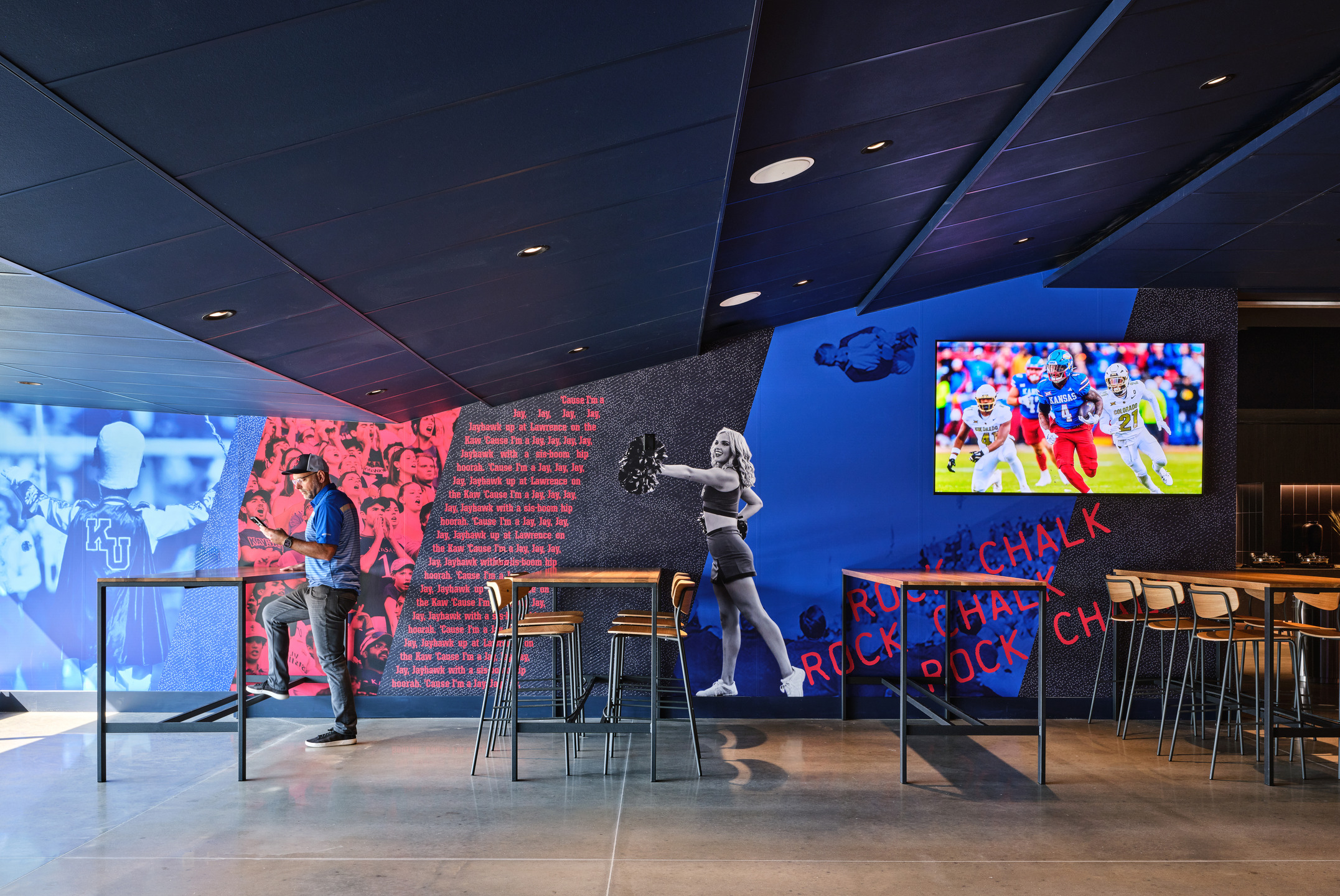 University of Kansas colors and phrases adorn the walls of the stadium's Field Club.