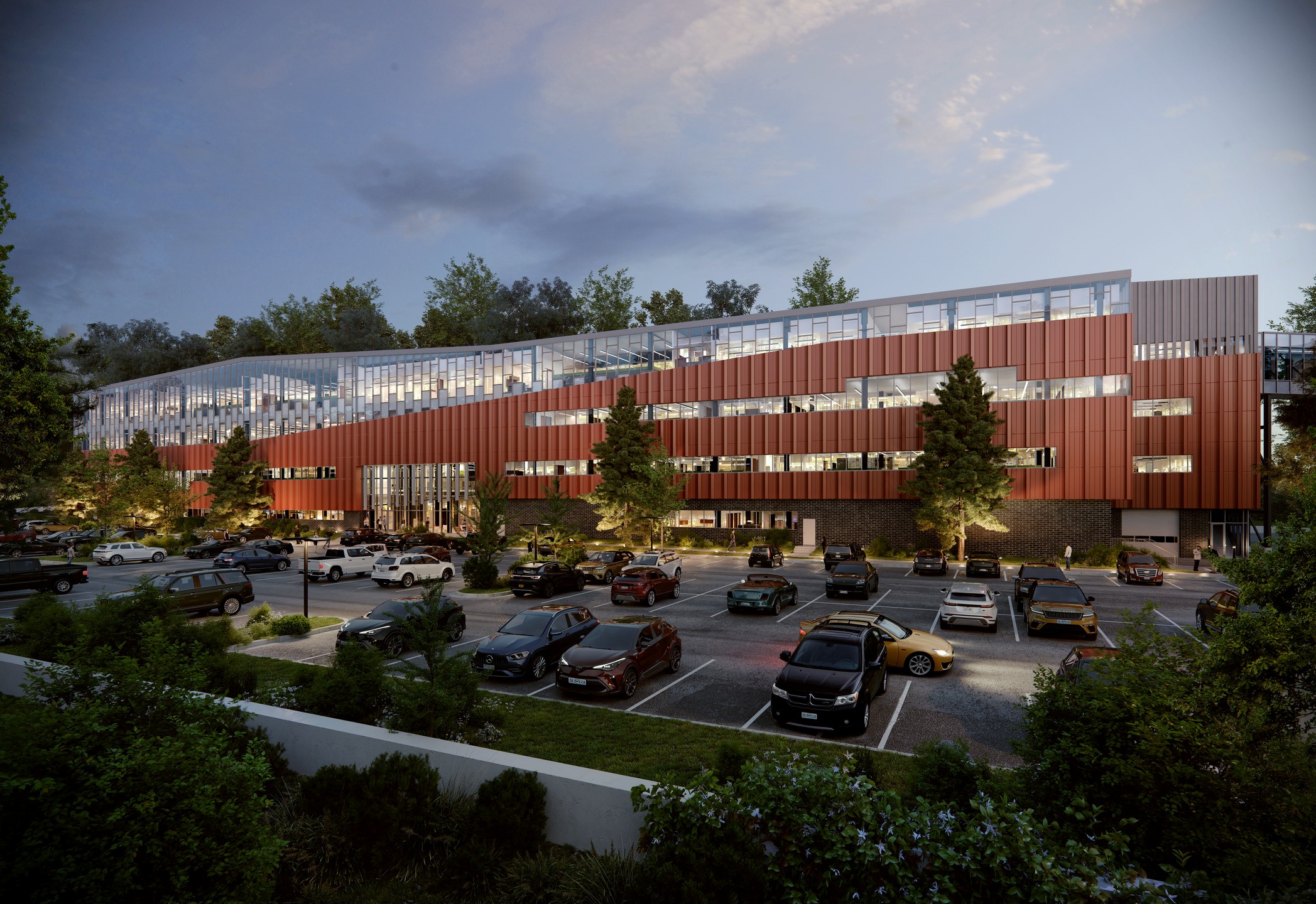 Glass sheeting and a burnt orange envelope enclose a rectangular laboratory building.