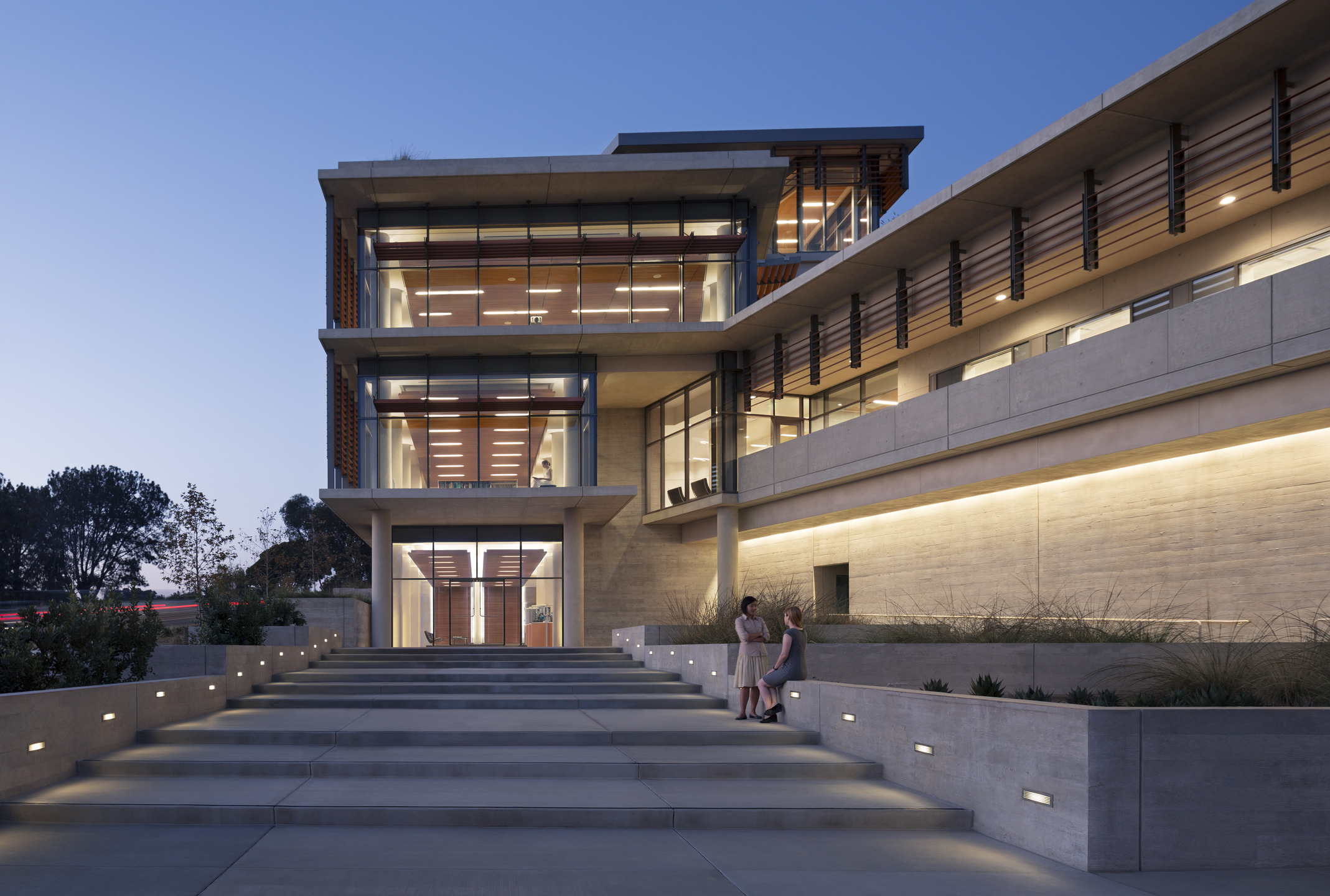 Image of the entry of NOAA Southwest Fisheries Science Center at dusk from which you can see the wooden ceiling of the three levels visible.