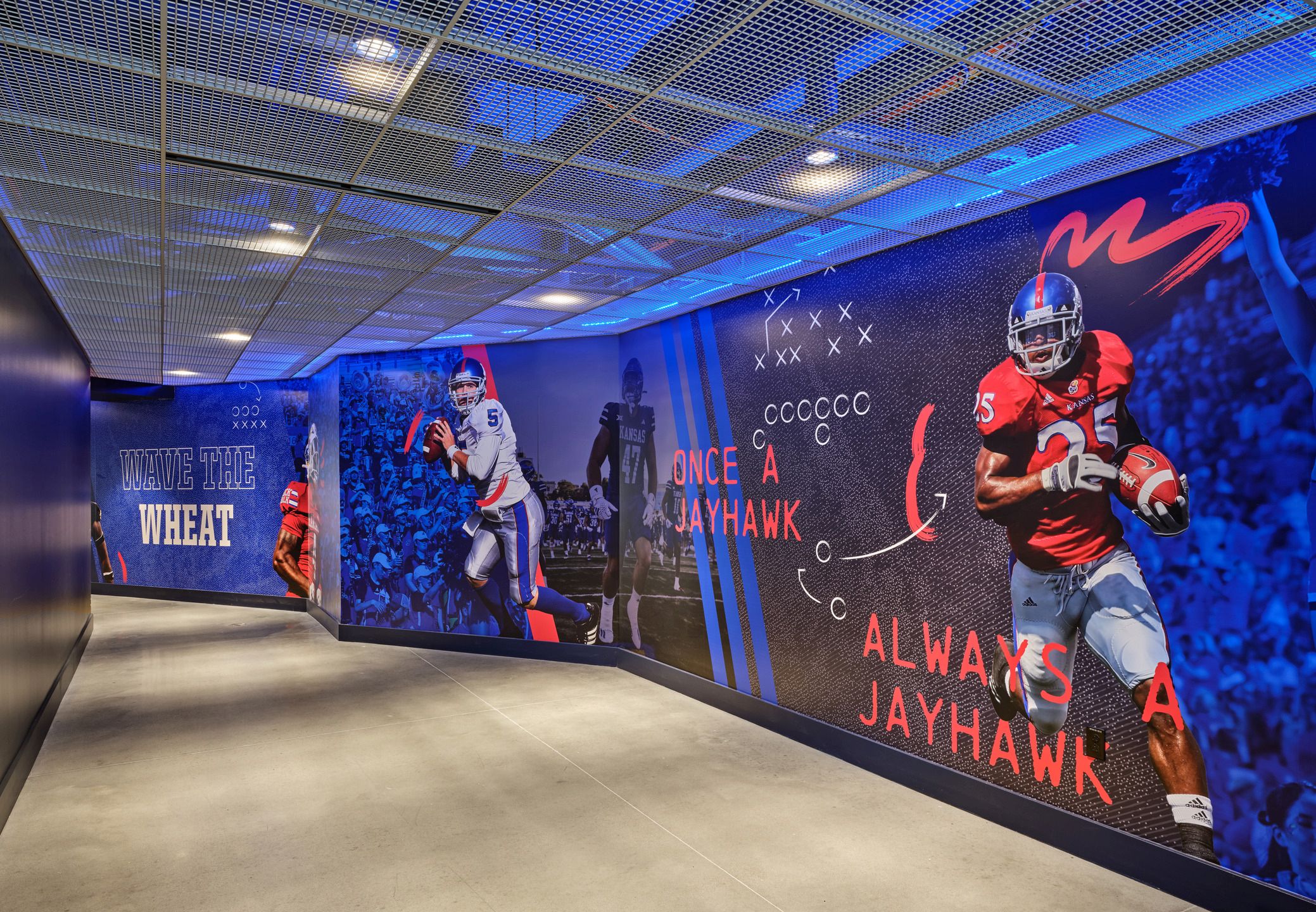 KU-branded graphics adorn the walls from the Field Club to the stadium. 