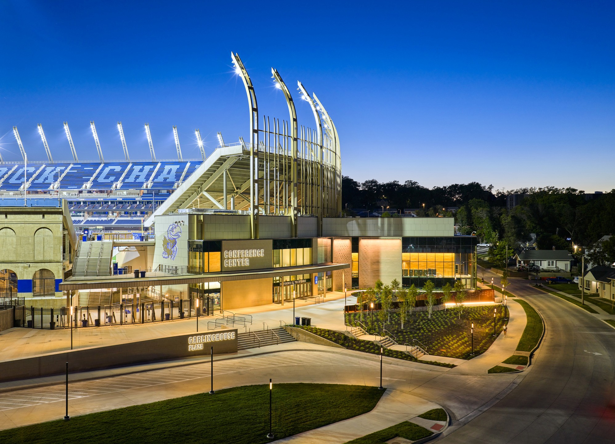 An interior view of the dining hall. A buffet and cooler have wood accents and are surrounded by menu screens.