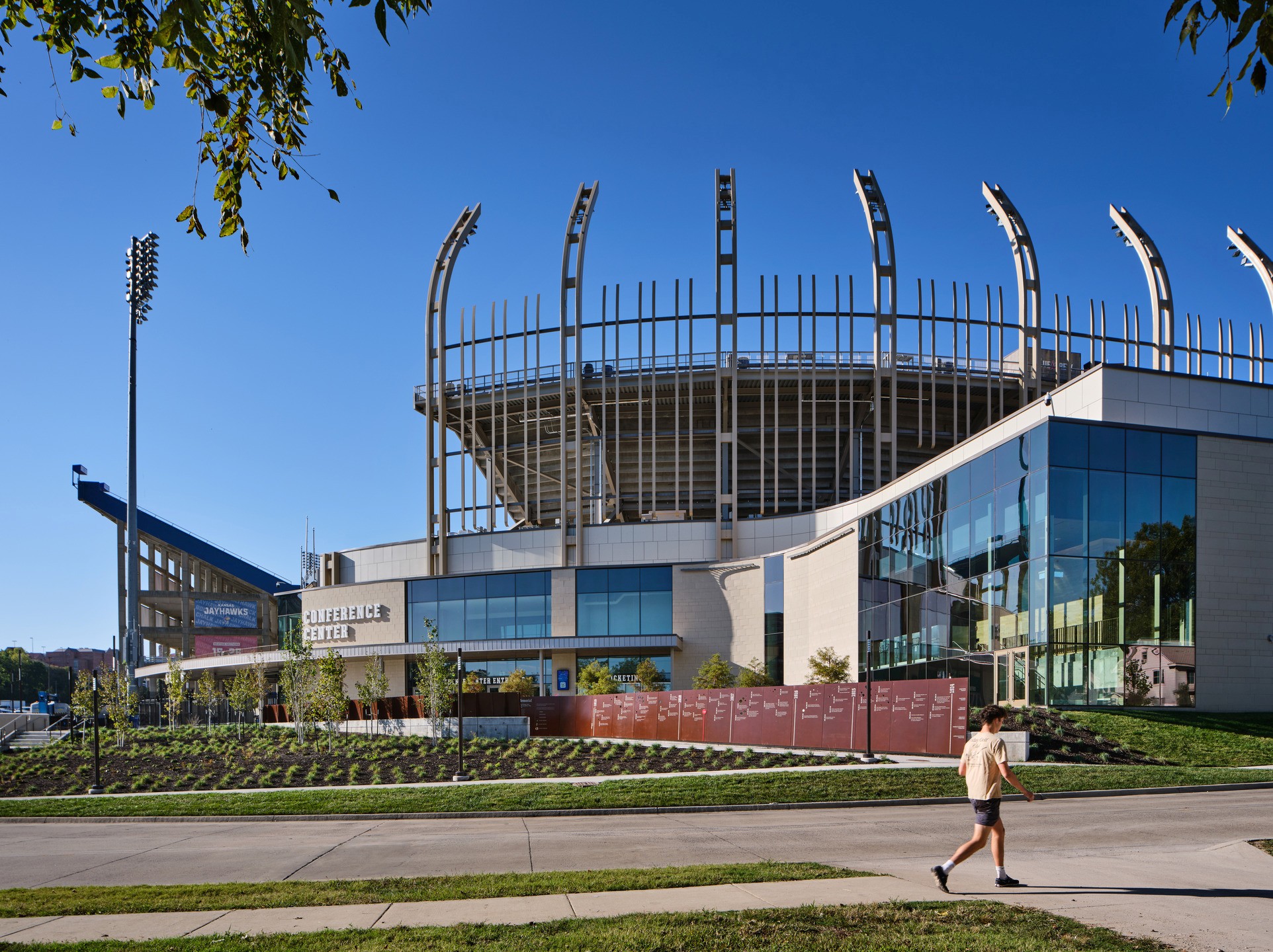 Soaring trusses from the David Booth Memorial Stadium are visible just beyond the University of Kansas Conference Center. 