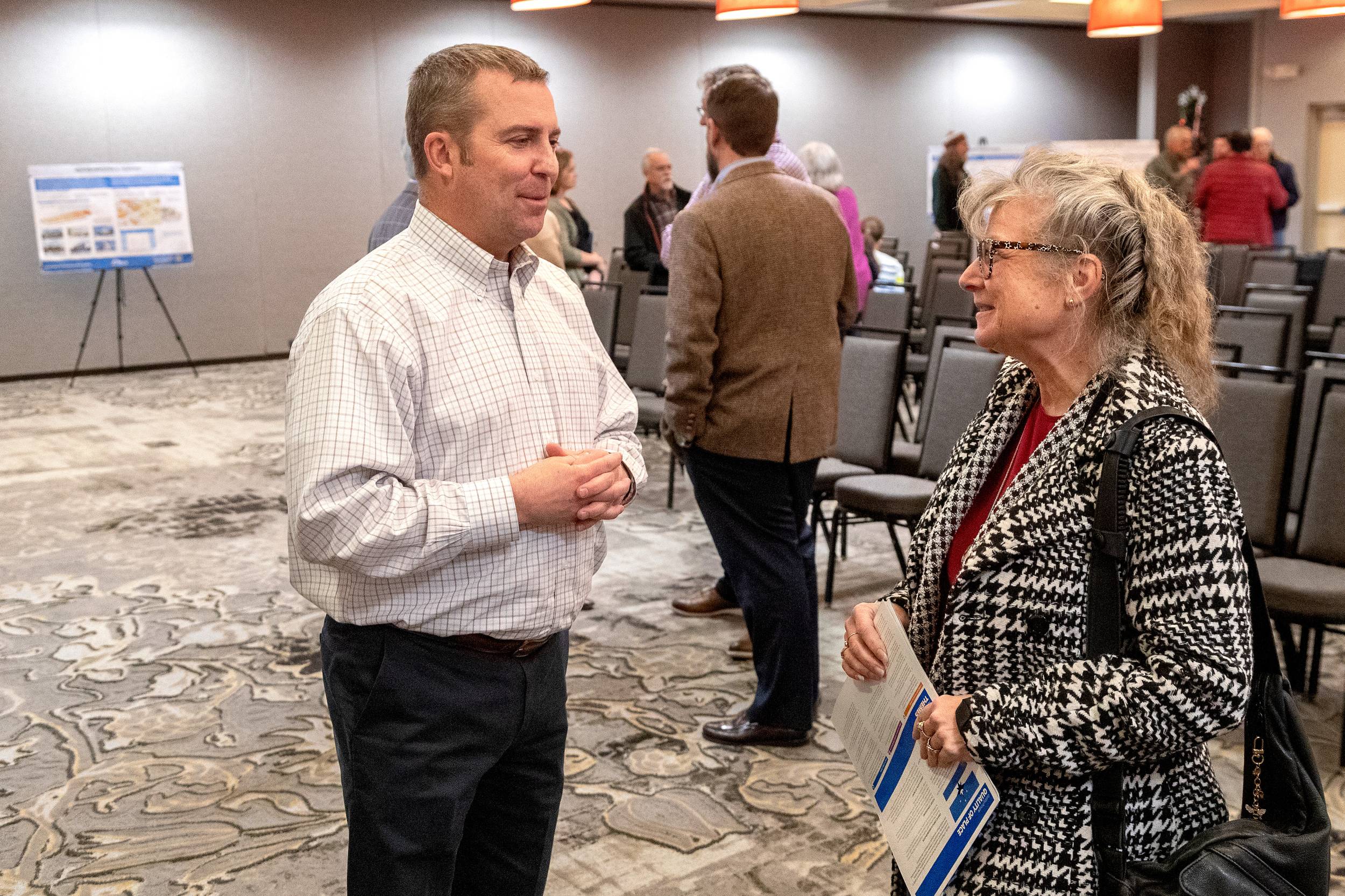 Multistudio Principal Graham Smith chats with a Springfield resident at a community engagement session. 