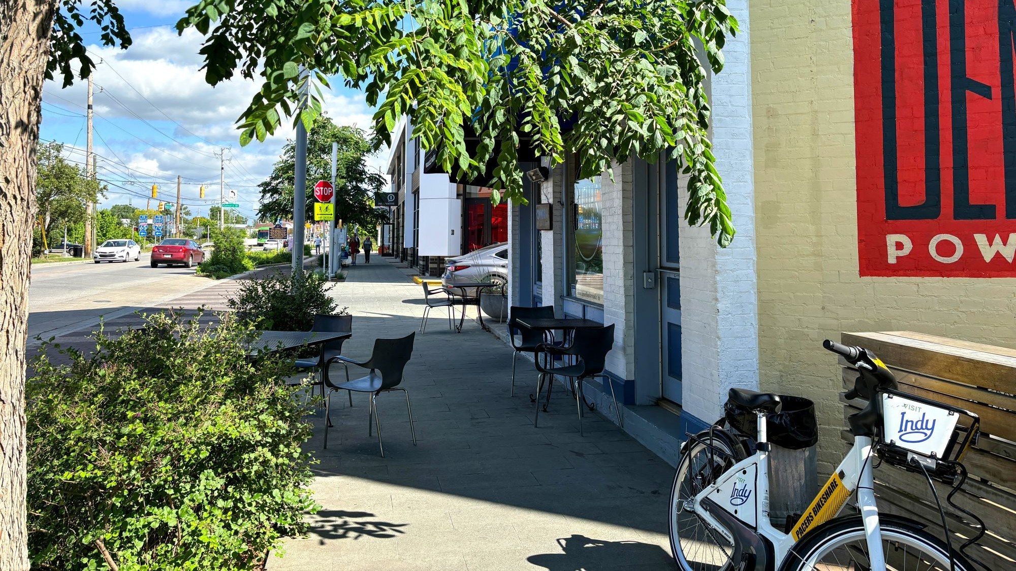 An urban trail with a cyclist and pedestrians. 