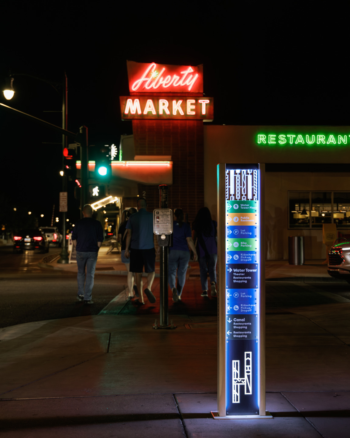 An illuminated sign gives directions in the Town of Gilbert Heritage District
