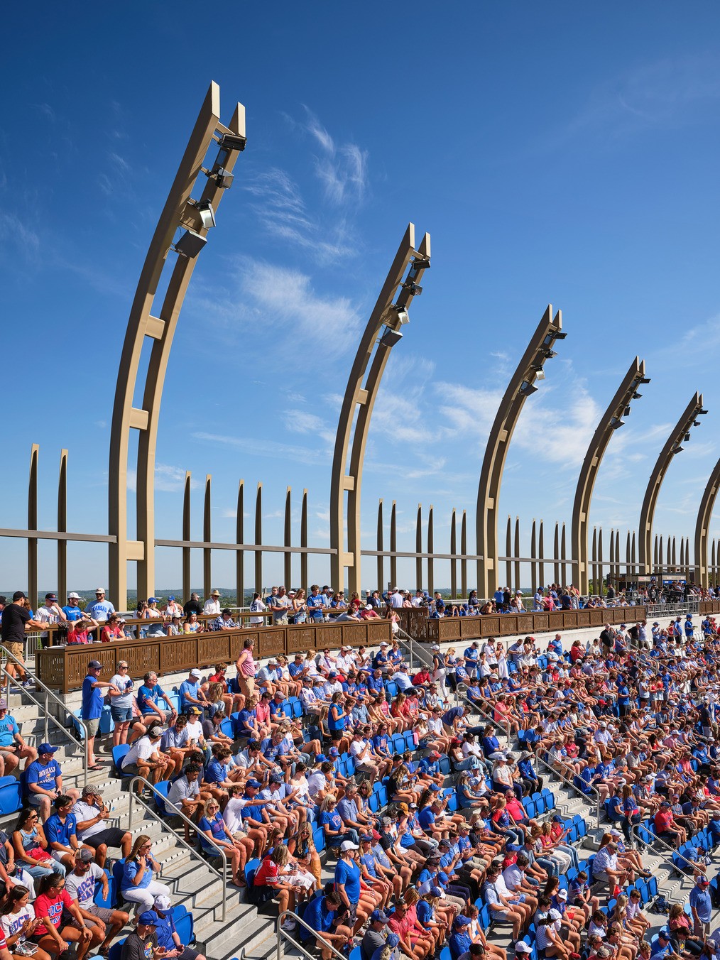 Fan fills the uppermost reaches of the stadium bowl seating.