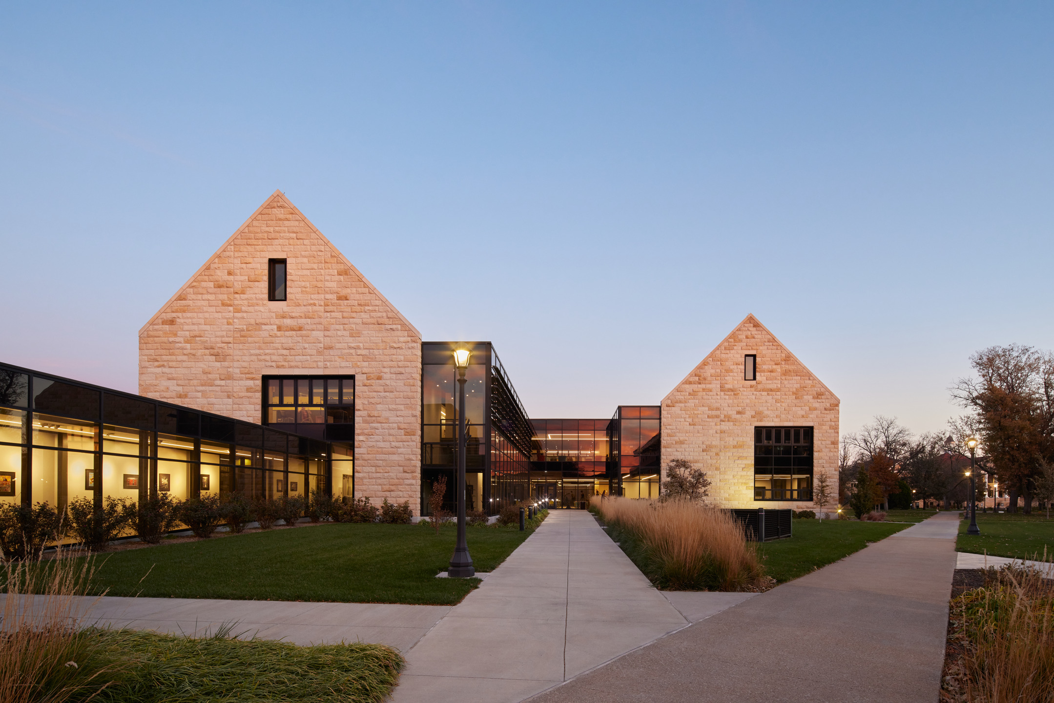 Exterior photo of the Schmidt Foundation Center for Art & Design at Fort Hays State University in dusk taken from the main quad.