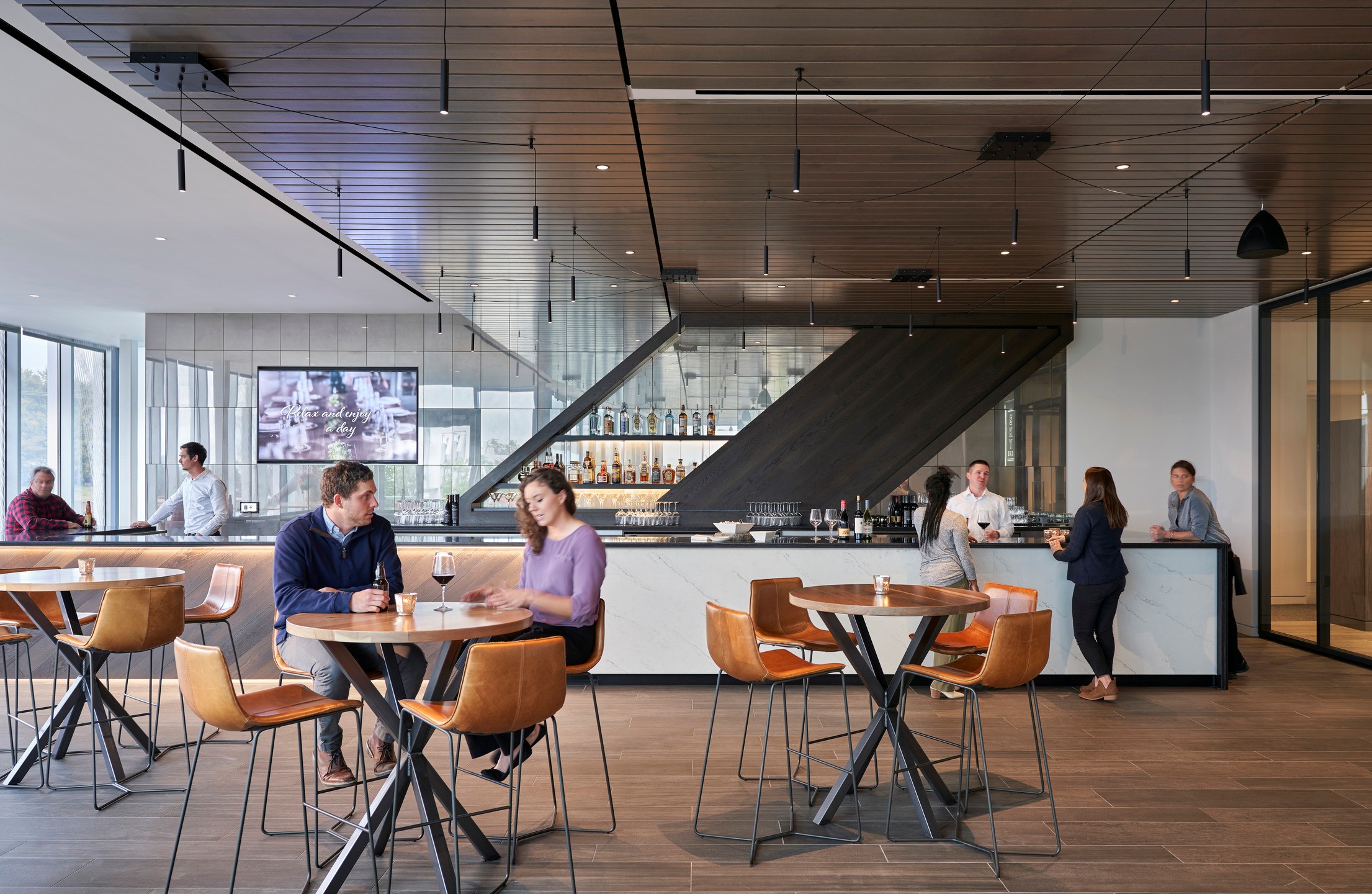 People socializing in the Engagement Center bar.