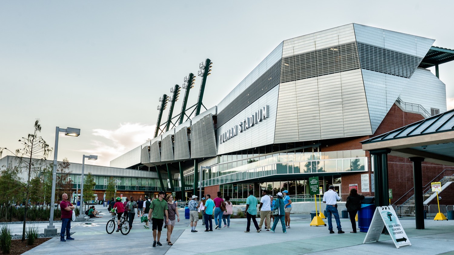 Image of crowds of people in the Yulman Stadium entry plaza.