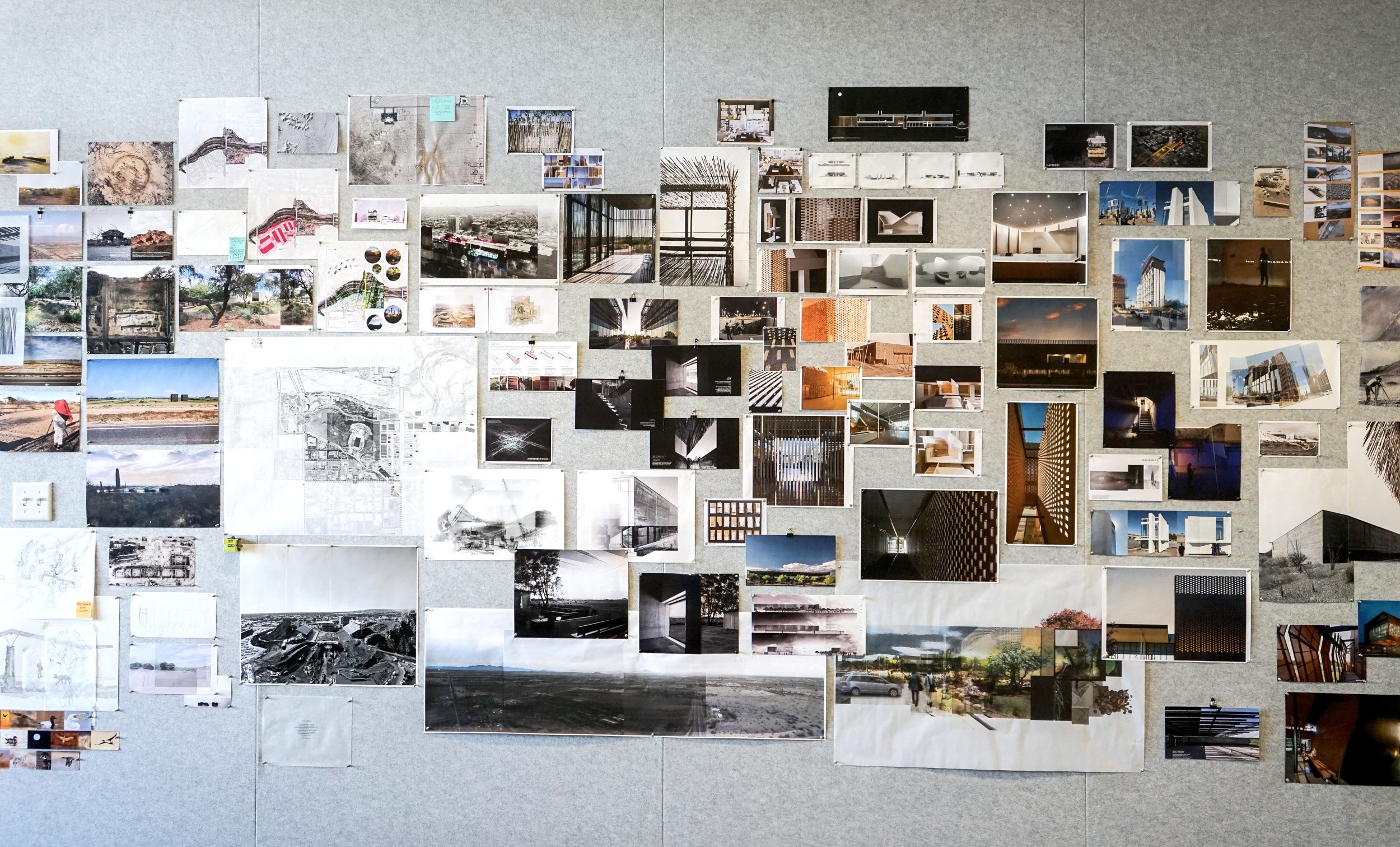 A project wall displays dozens of images, drawings, and site photos for a project in Phoenix.