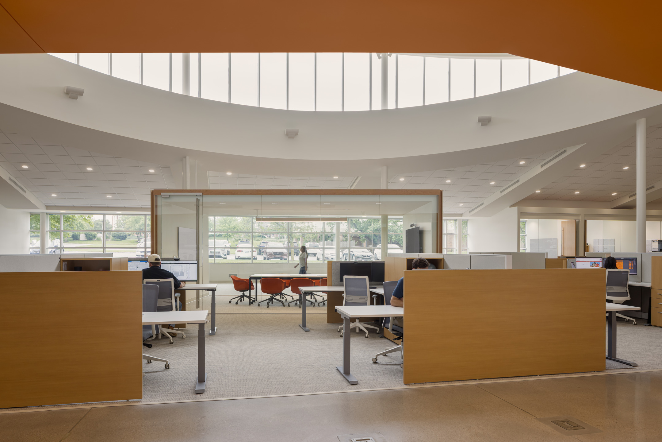 Floor-to-ceiling glass windows and a central clerestory provide ample natural lighting in the renovated Newkirk Novak headquarters.