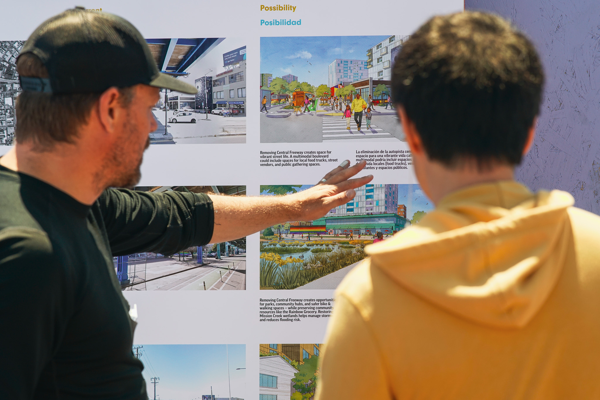 At an engagement session for a highway design proposal, Ian Colburn discusses design plans with a community member. 