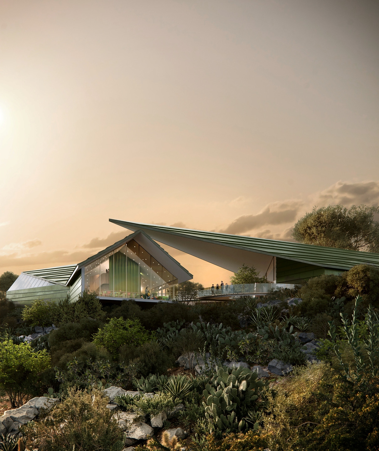 The sloped green roof of the New Mexico Literacy Institute makes it look like part of the surrounding landscape.