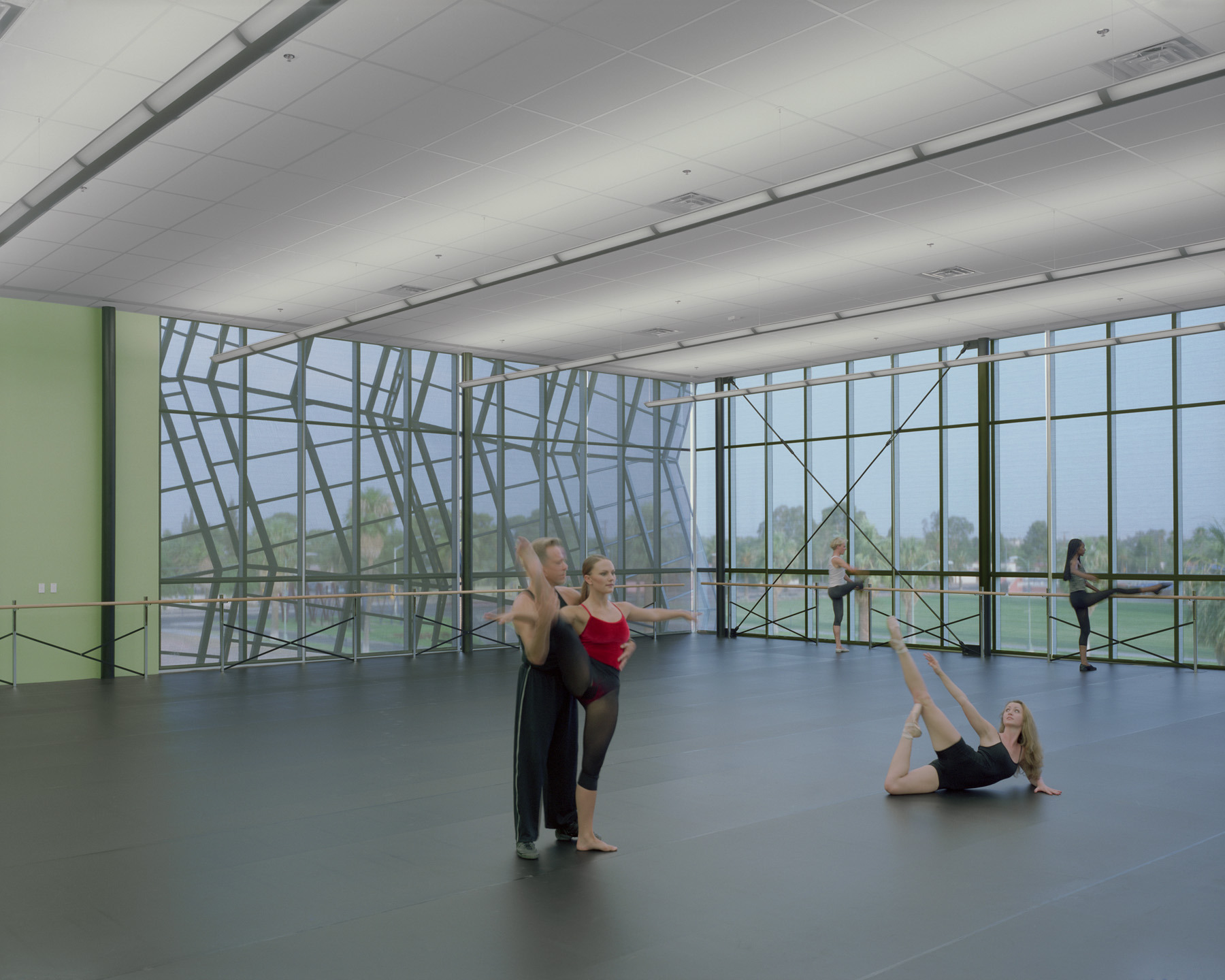 The dance studios feature floor-to-ceiling windows. 