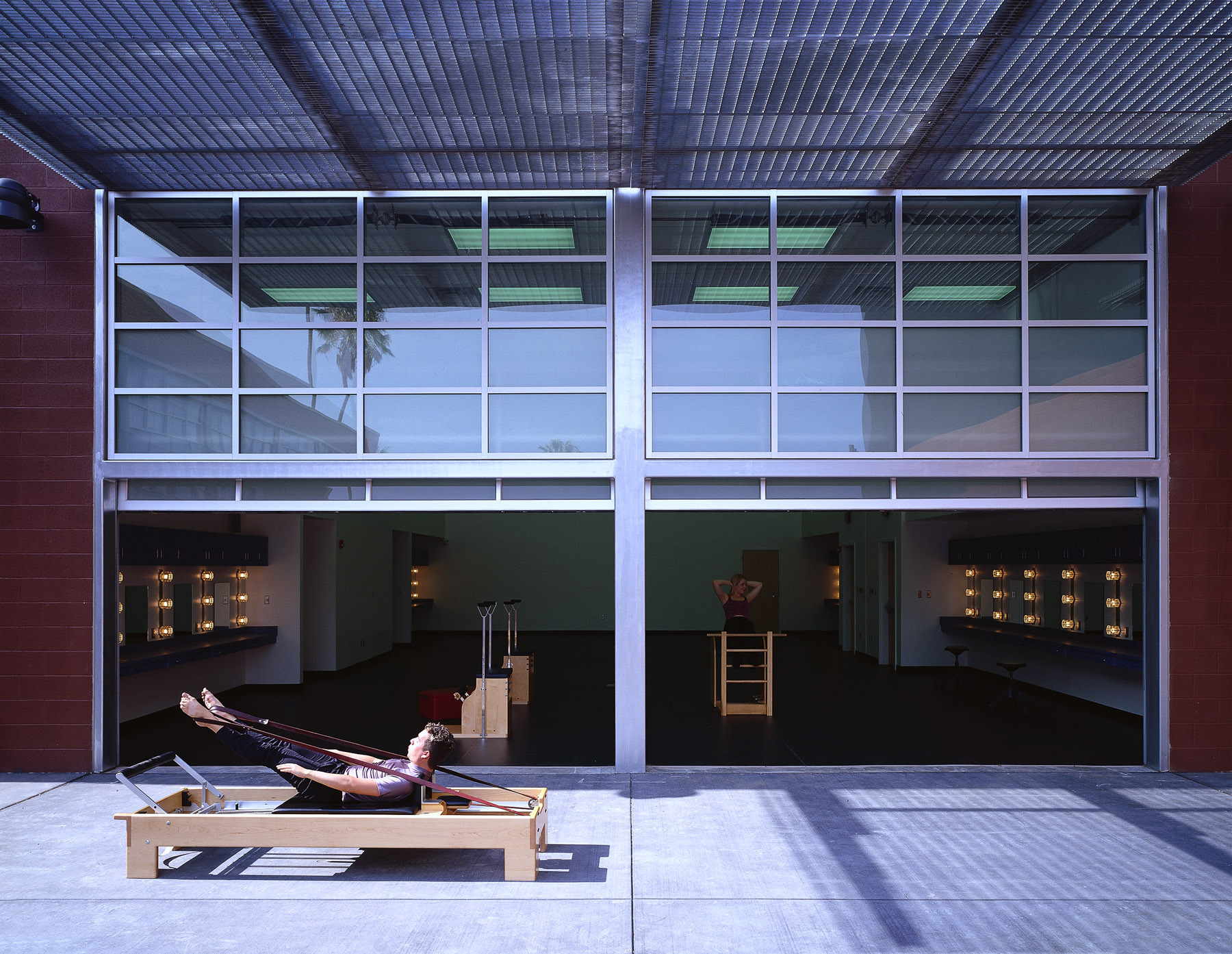 Roll-up “garage doors” allow for the somatic studio to spill into a wellness garden.