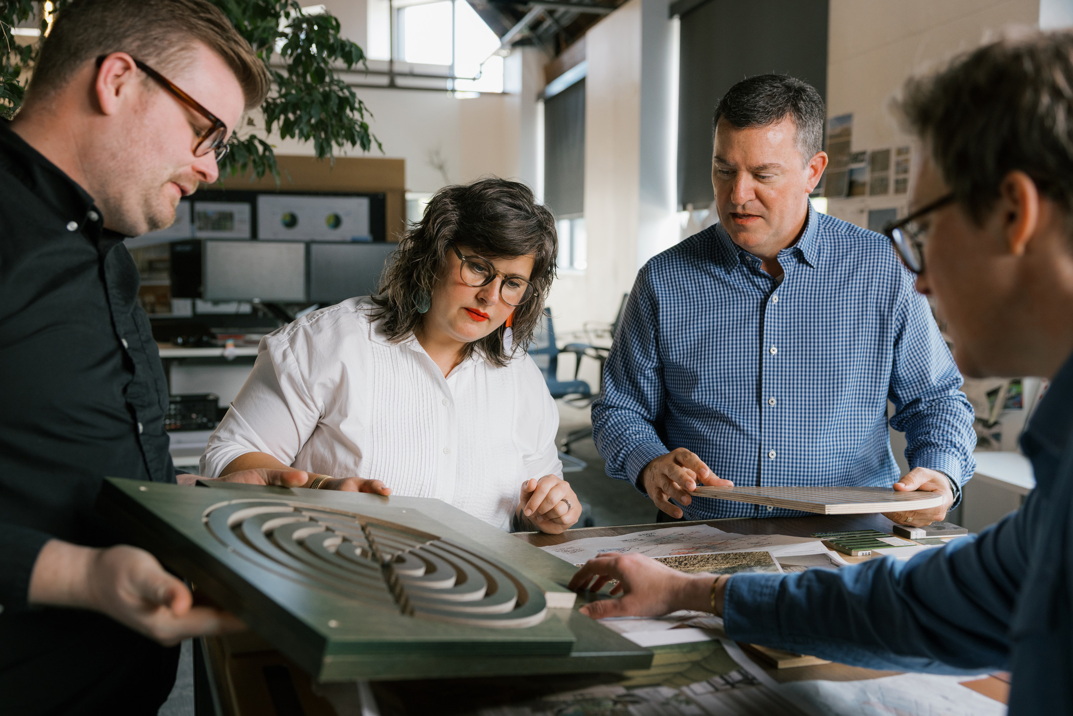 Amanda Harper and Dan Zeller collaborate with Multistudio colleagues.
