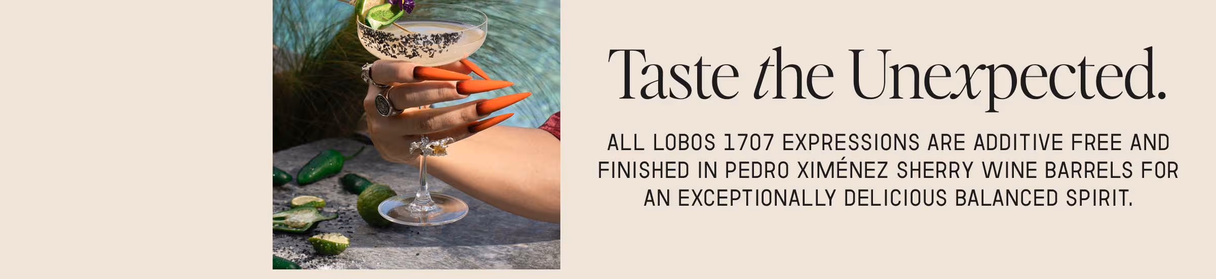 A cocktail hold by a hand.