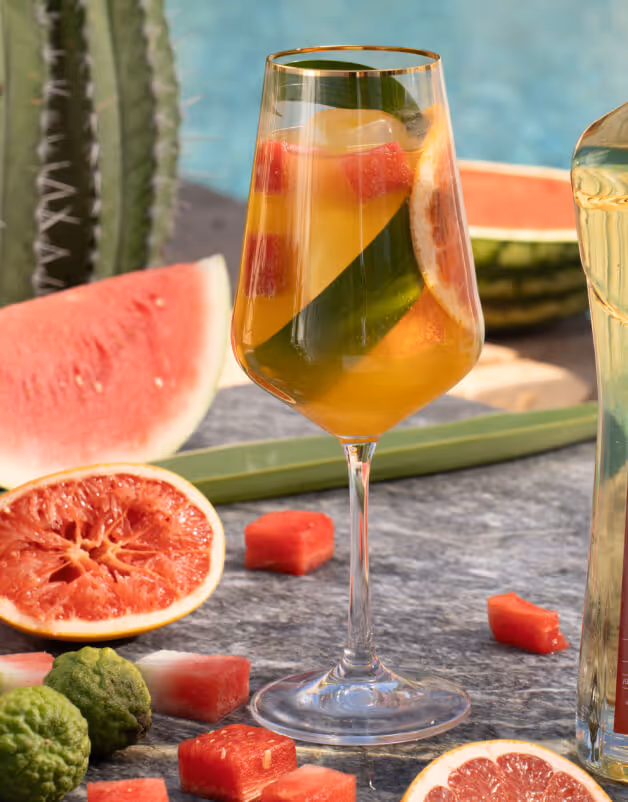 A  Lobo 1707 tequila with background ingredients on table