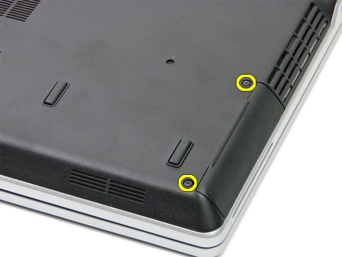 photo of a fliped laptop and marked location of the hard drive bay