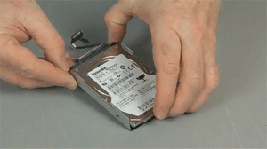 gif of a person pulling the hard drive out of the mounting bracket