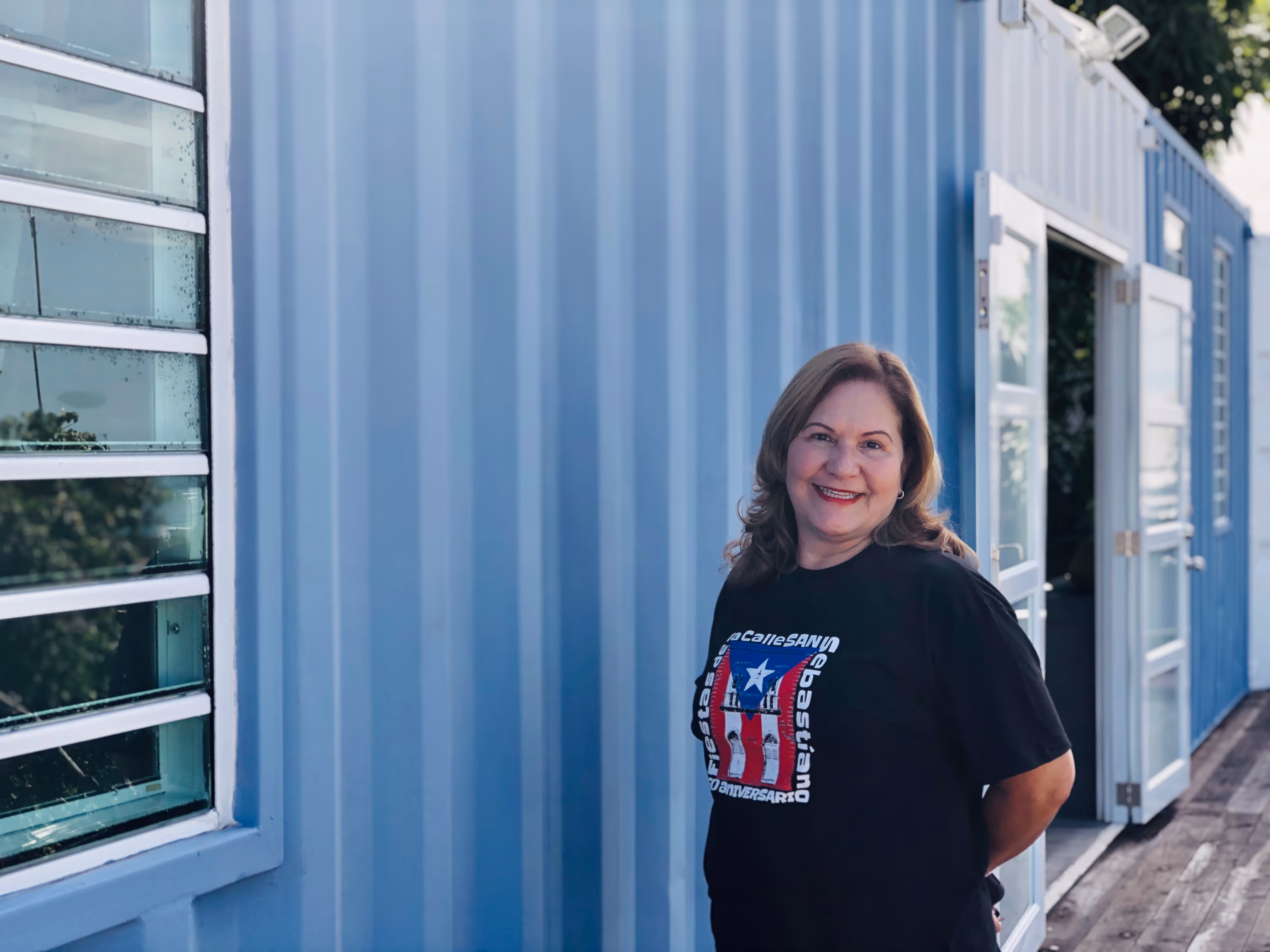 A happy owner of her shipping container home.