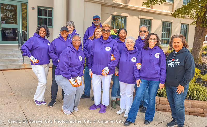 Members of Calumet City's Senior Advisory Council pose for a group shot in front of City Hall