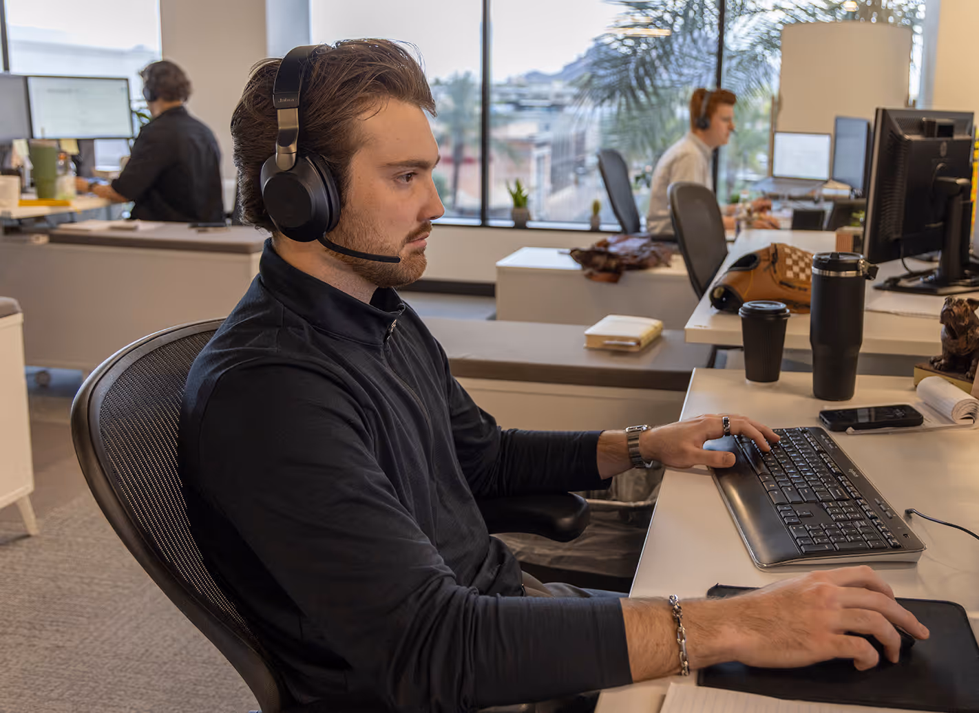 Global Client Group CIM employees working at their desks in the Phoenix, AZ office
