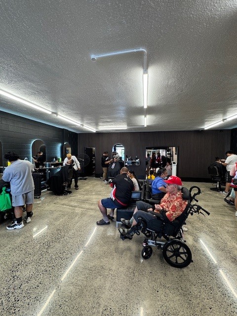A group of elderly gentlemen sitting