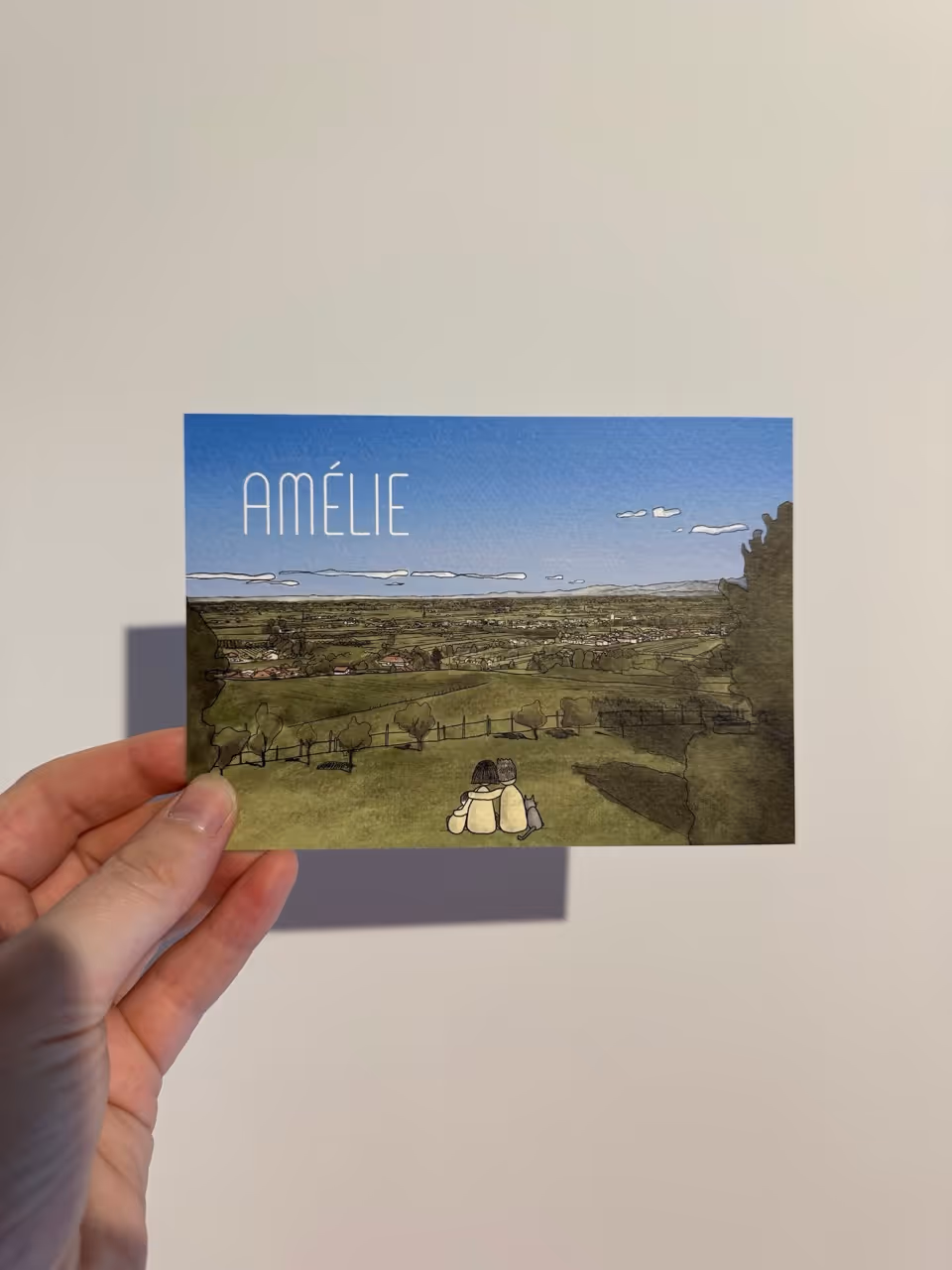 Geboortekaart 'Amélie' met illustratie van een landschap en gezin