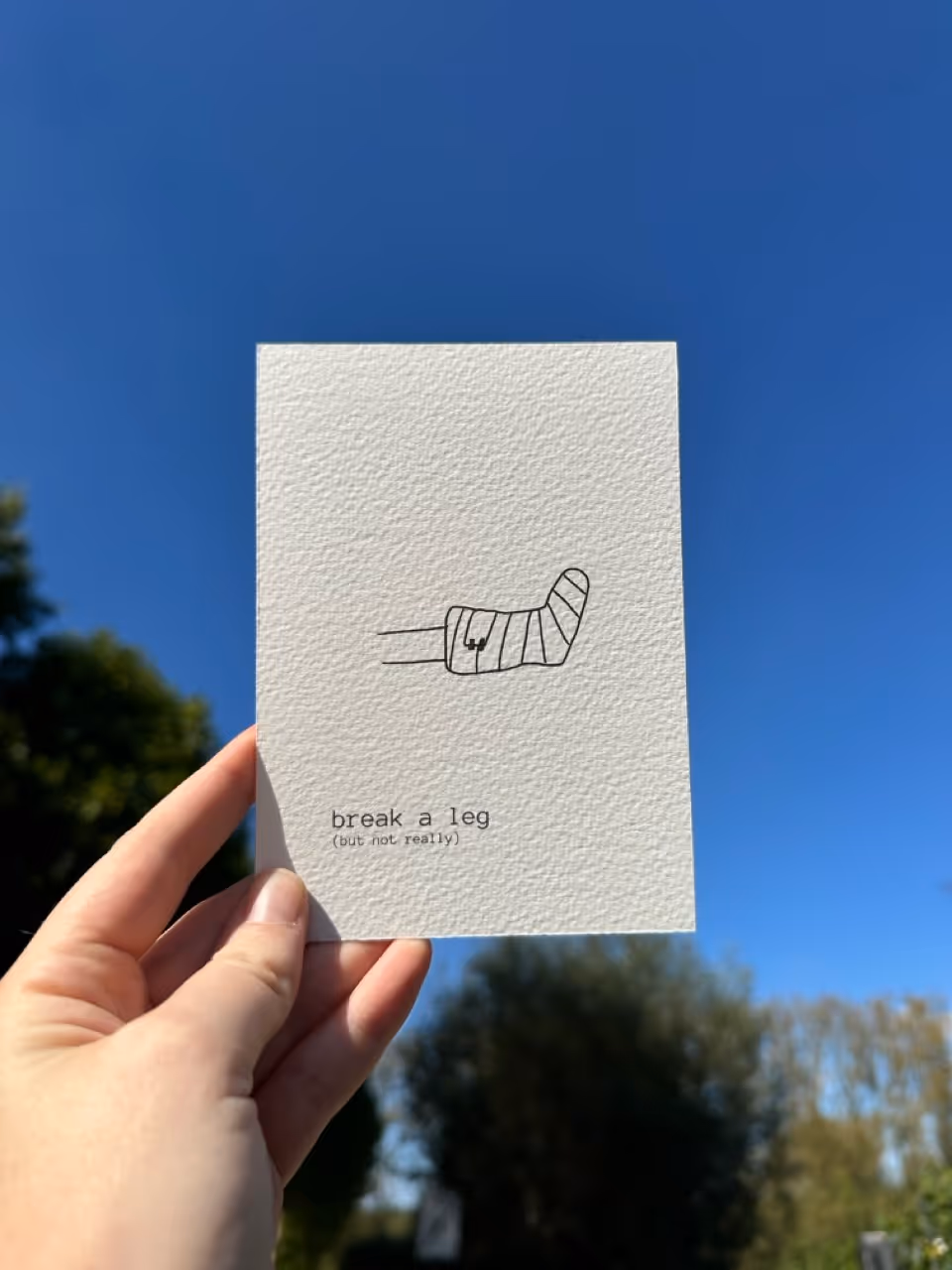 Wenskaart 'Break a leg' met lijntekening