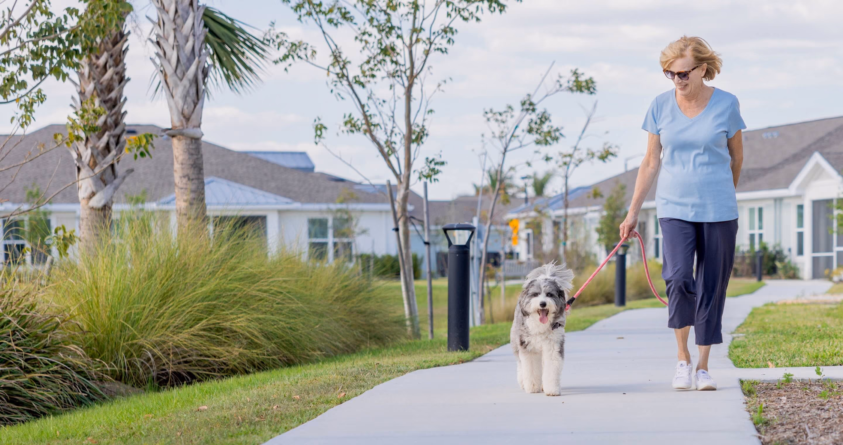 Senior walking her dog