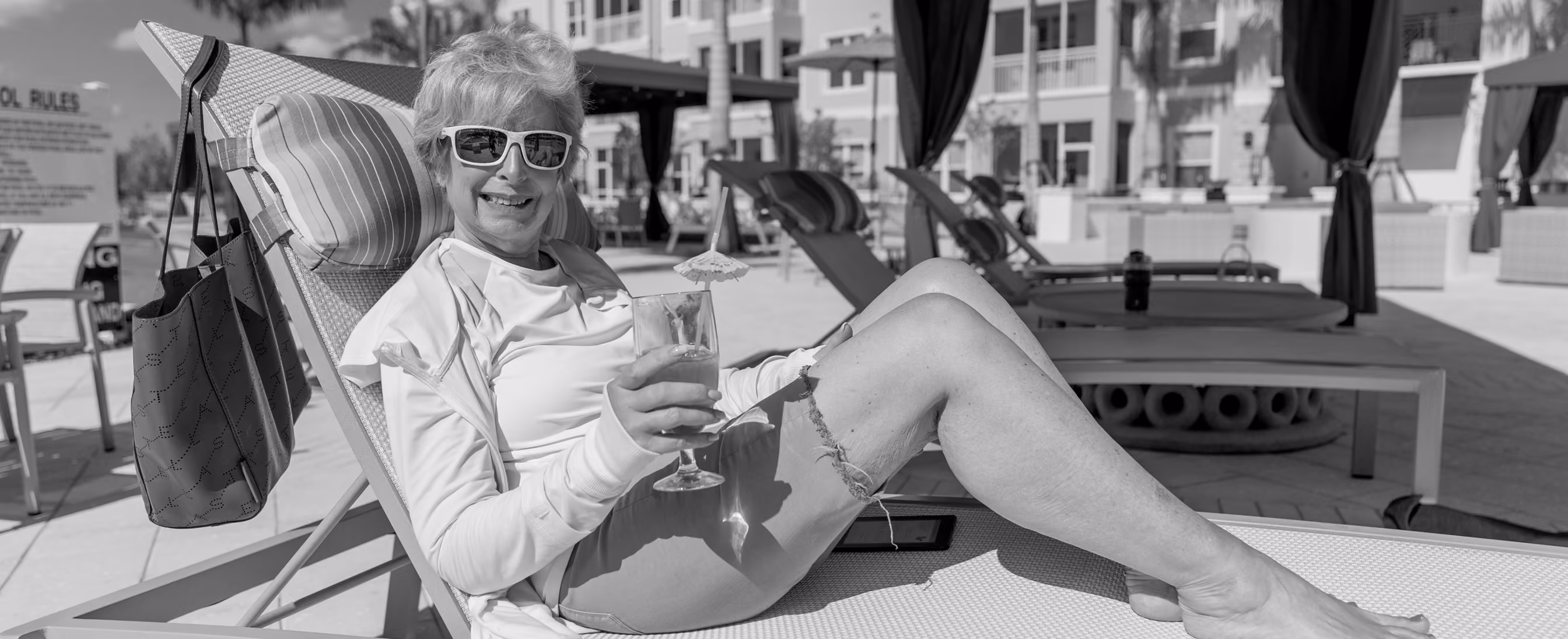 Senior relaxing on a poolside chair