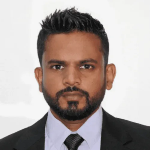 A man wearing a suit and tie.