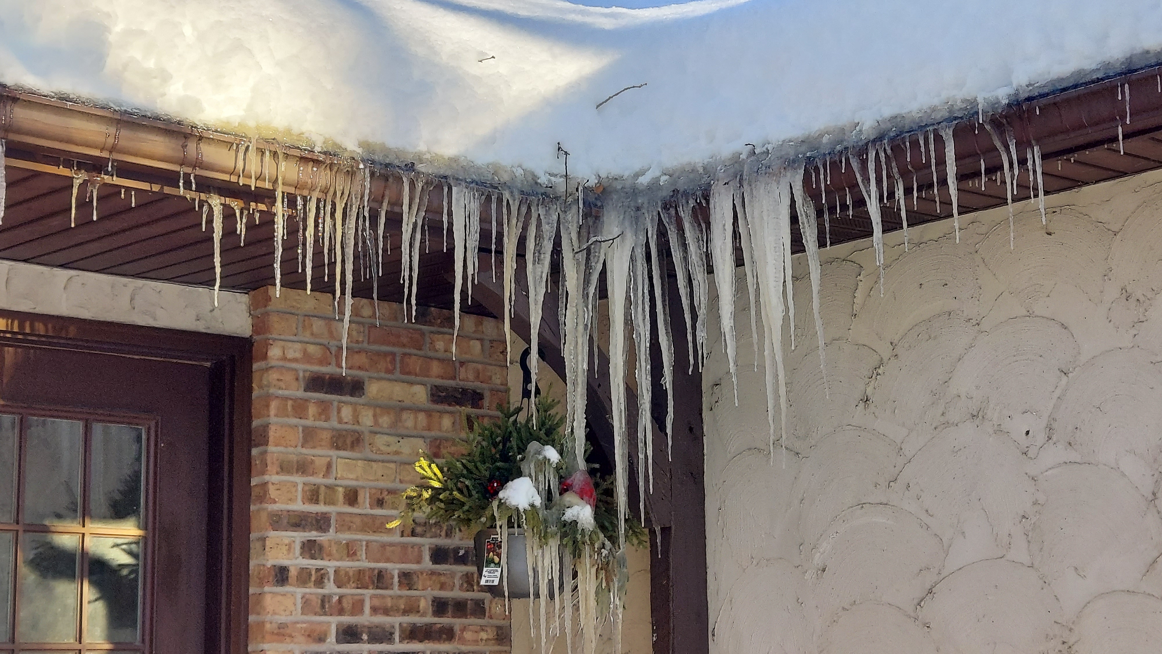 Ice dam and icicles on Twin Cities home eaves