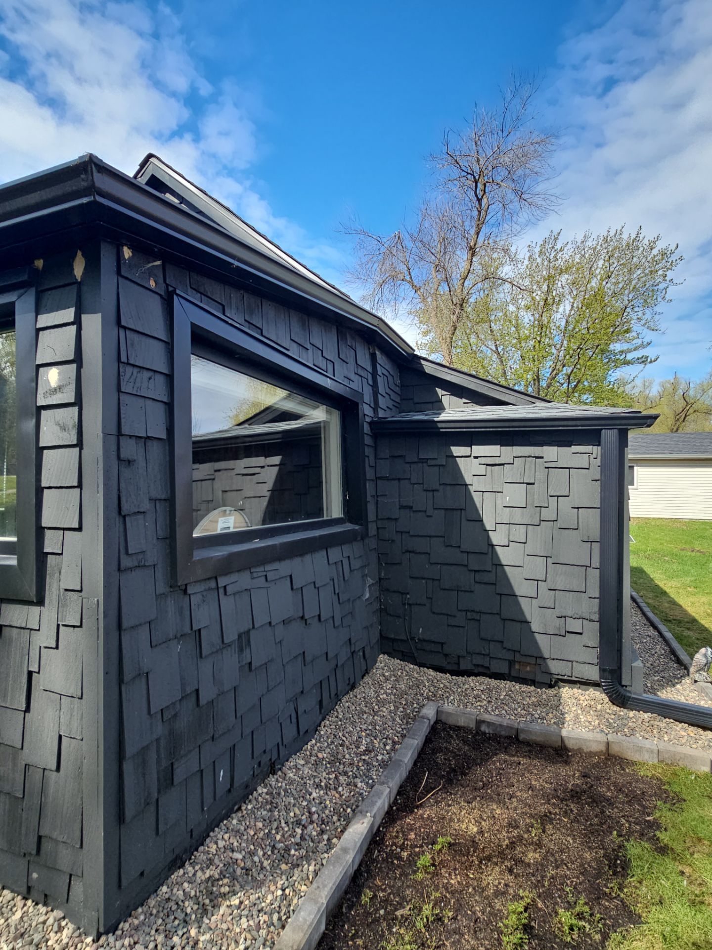 Finished asphalt roof and gutters in Wayzata by Storm Master