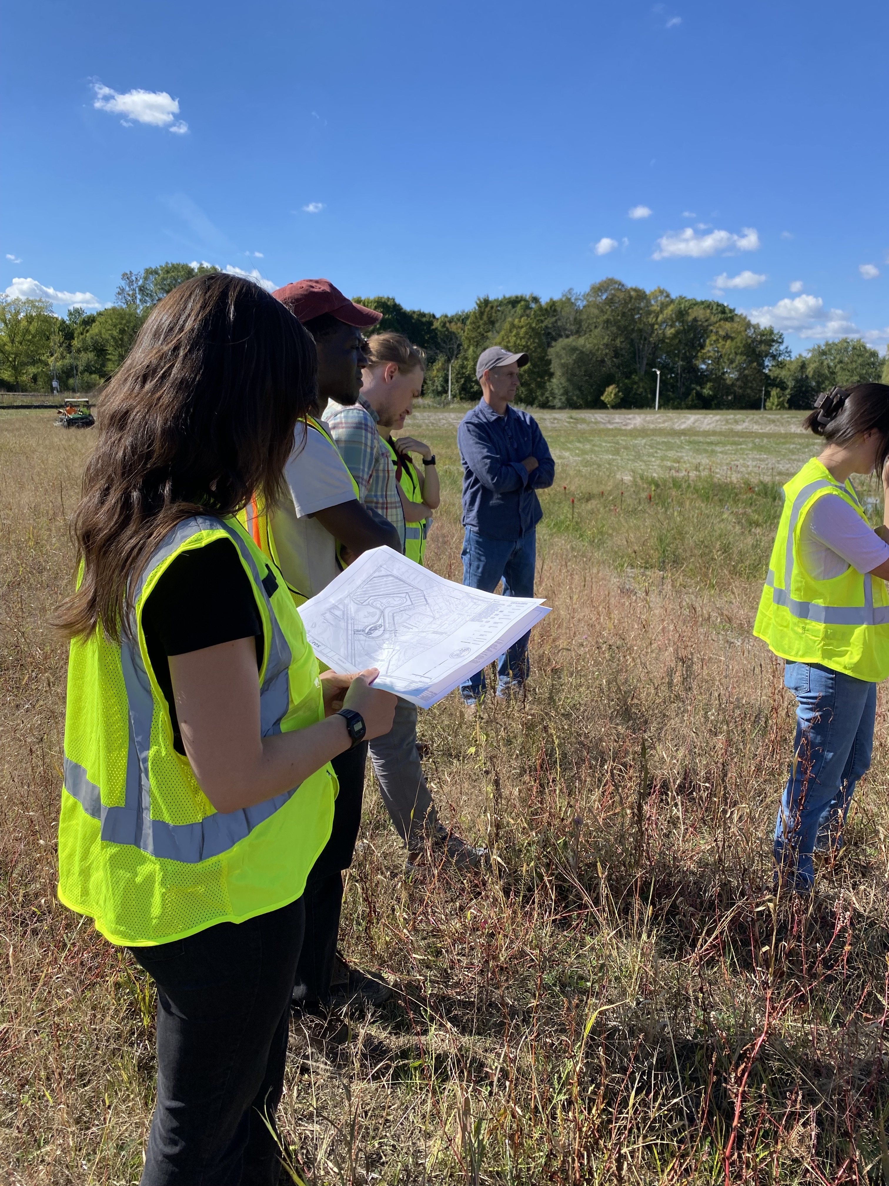 Engineer looking at documents outside