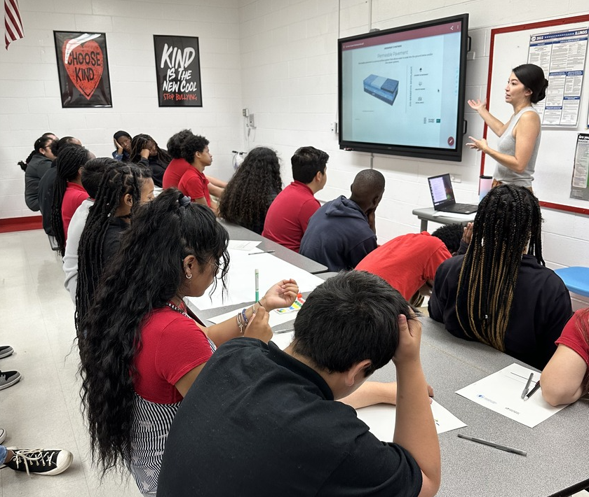 Woman standing in front of classroom presenting