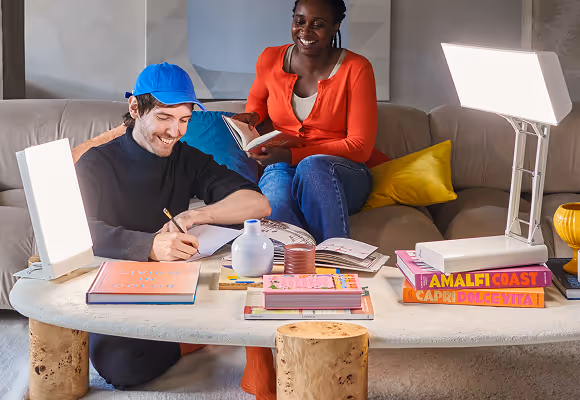 Two people sitting at the kitchen marble