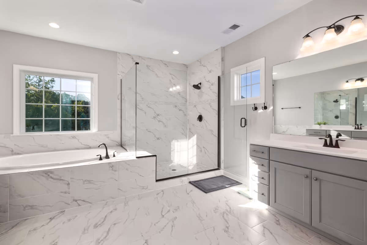 full bathroom layout with marble bath and shower